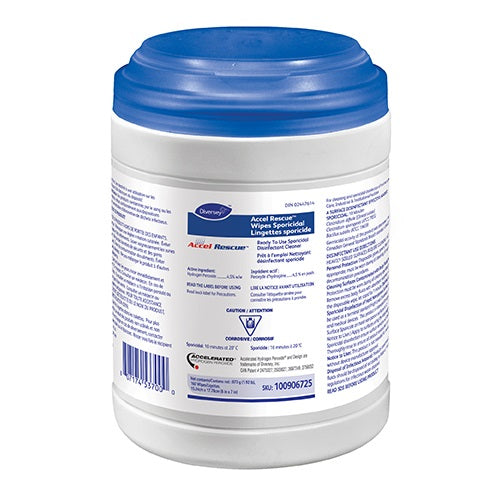 A container of Accel Rescue sporicidal wipes sits upright. The container is white with a blue lid and contains detailed product information including SKU 100906725.
