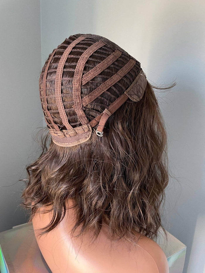 Back view of the Bianca Short Dark Brown Wig with Bangs showing the wig cap construction and soft waves.