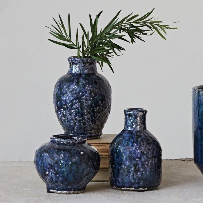 The CREATIVE COOP Decorative Terracotta Vase with Blue Crackle Glaze, Large, features a rounded body and narrow neck for a striking accent, shown isolated on a white background.