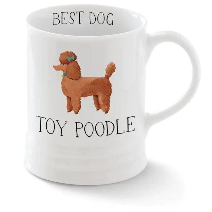 The FRINGE STUDIO - CERAMIC TOY POODLE MUG by PET SHOP BY FRINGE STUDIO features a brown toy poodle with a blue bow, "BEST DOG" above and "TOY POODLE" below—an adorable addition to any mug collection.