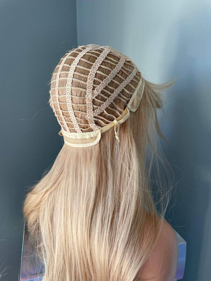 Blonde hair extension with lace front on a plain background