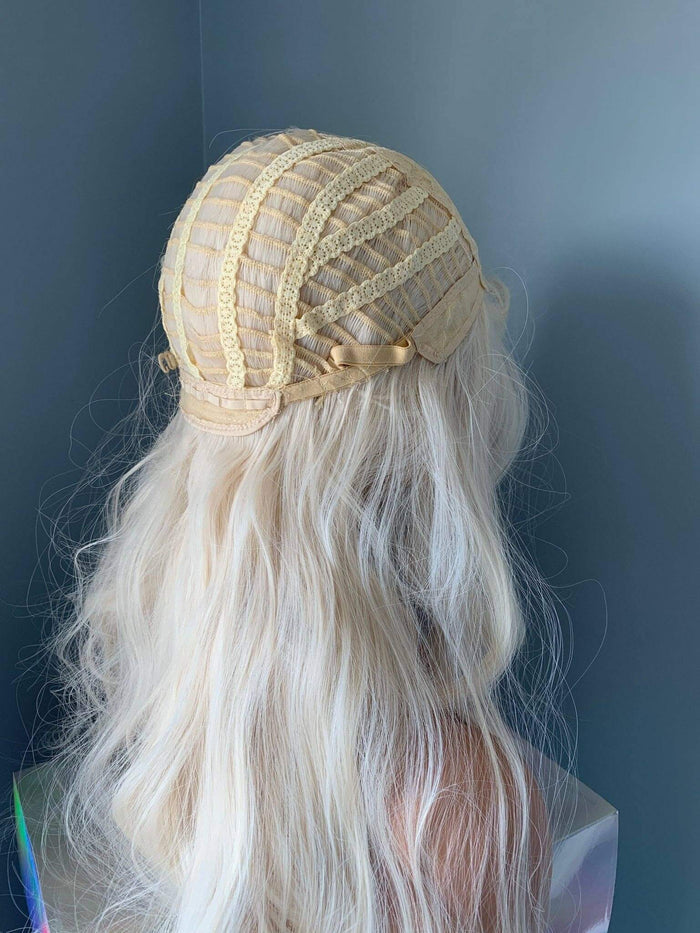 Back view of a Gwen Long Blonde Layered Wig cap showcasing the styling and construction features.