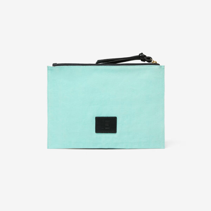 The INOUI EDITIONS - SPLASH EMBROIDERED POUCH by INOUI showcases a rectangular design with vibrant, hand-embroidered fish and coral on a light blue backdrop. This pouch features seaweed in shades of green, pink, blue, and brown, highlighting exquisite textile art.