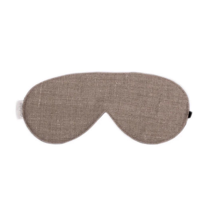 The SLEEP MASK LINEN by E WIGHTMAN & CO is a brown washed linen eye mask with a soft, simple texture, shown on a white background. This adjustable mask provides comfort for restful sleep.