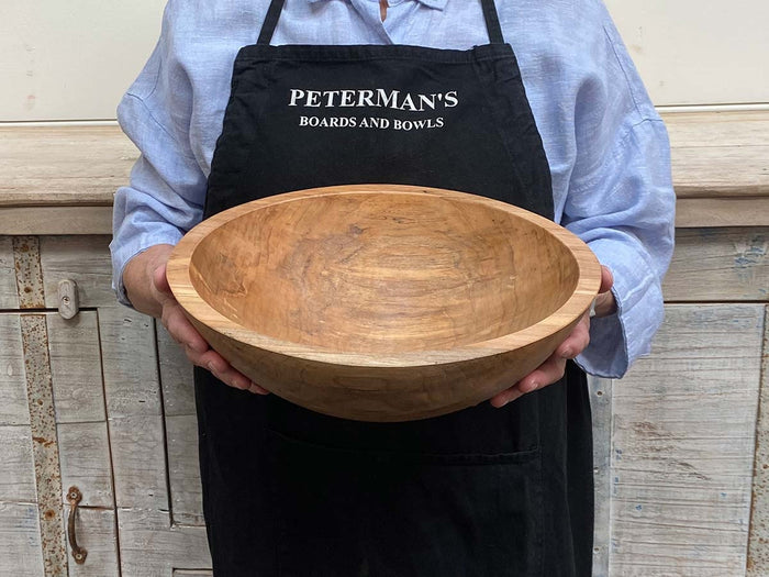 A handcrafted SPENCER PETERMAN - SPALTED MAPLE BOWL 13" by PETERMANS BOARDS & BOWLS INC, featuring a round shape with a light, natural finish and striking spalted maple grain patterns, displayed on a white background.