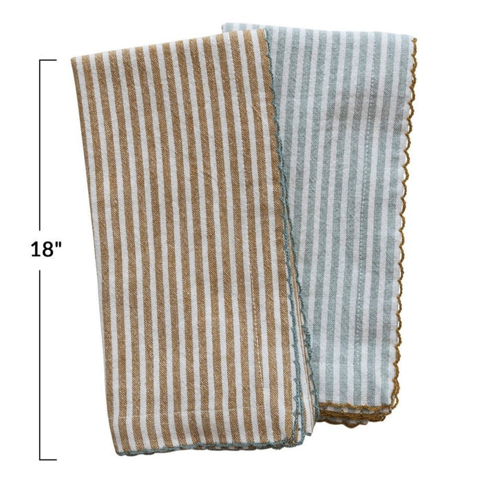 The CREATIVE COOP STRIPED COTTON NAPKIN WITH SCALLOP TRIM comes in aqua or mustard. Each 18" reusable napkin adds a stylish touch to your table linens collection.