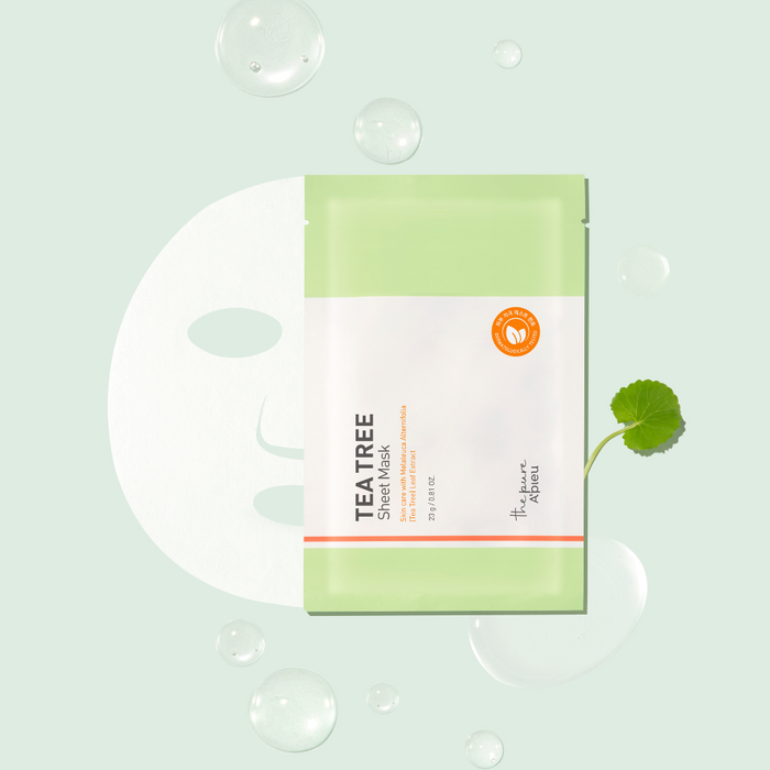 Tea tree sheet mask packaging on a light green background with bubbles