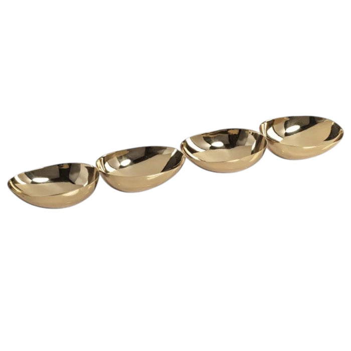 The ZODAX 4-BOWL NUT/SNACK SERVER – POLISHED GOLD features four gleaming gold-colored oval bowls arranged in a straight horizontal line on a white background, forming an elegant server that also serves as a striking sculptural centerpiece.