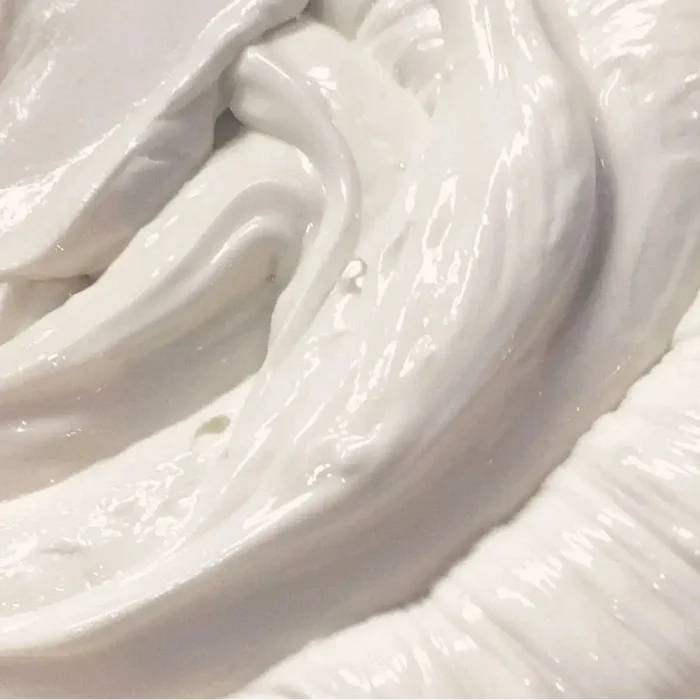 Close-up of creamy texture of Antioxidant Botanical Moisturiser by Dope Skin, showcasing its lightweight and hydrating properties.