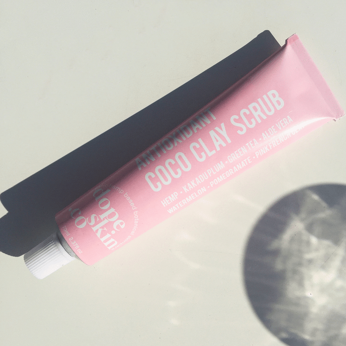 Antioxidant Coco Clay Scrub from Dope Skin in a pink tube with natural ingredients listed.