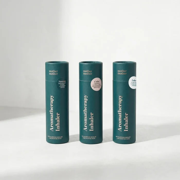 Three green aromatherapy inhaler containers on a white background