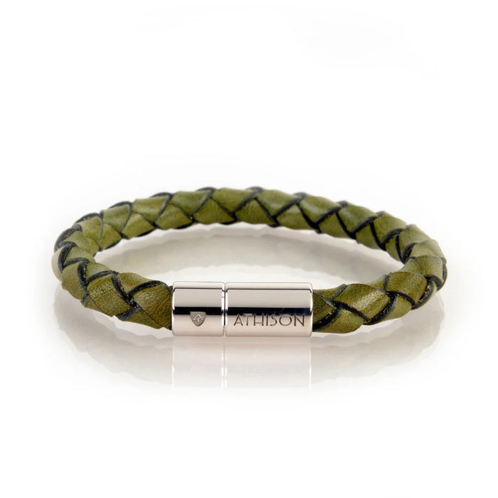 The ATHISON - BRAIDED LEATHER BRACELET IN GREEN features Italian craftsmanship, with a green leather braid and a silver clasp engraved "ATHISON," shown on a white backdrop.