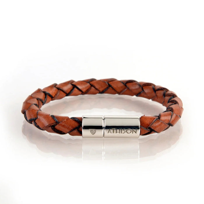 The ATHISON - BRAIDED LEATHER BRACELET IN LIGHT BROWN features Italian craftsmanship with braided leather and a silver clasp engraved "Athison," showcased on a white background.