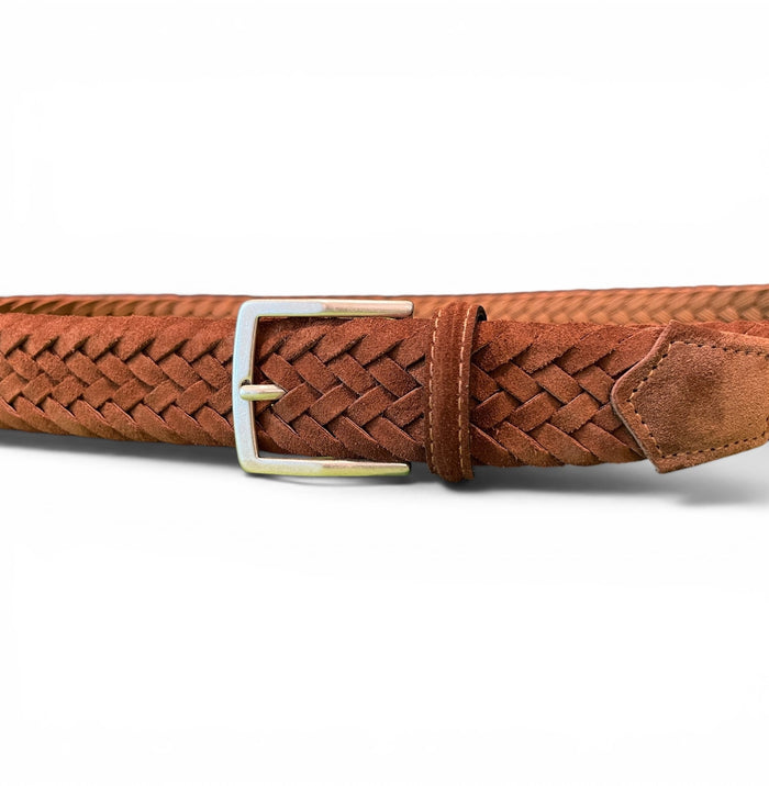 The ATHISON - BRAIDED SUEDE BELT IN BROWN is a premium men’s belt by ATHISON, featuring a brown braided suede design with a silver rectangular buckle, neatly coiled on a white background.