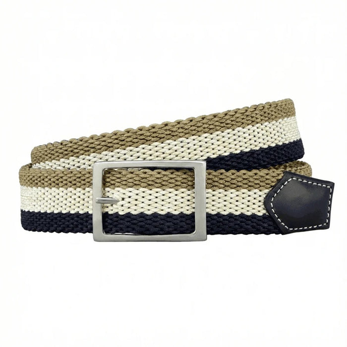 A close-up of the ATHISON Reversible Stretch Belt in navy, khaki, and white stripes with a silver buckle and navy leather details, shown on a light wooden surface; reverses to solid navy.
