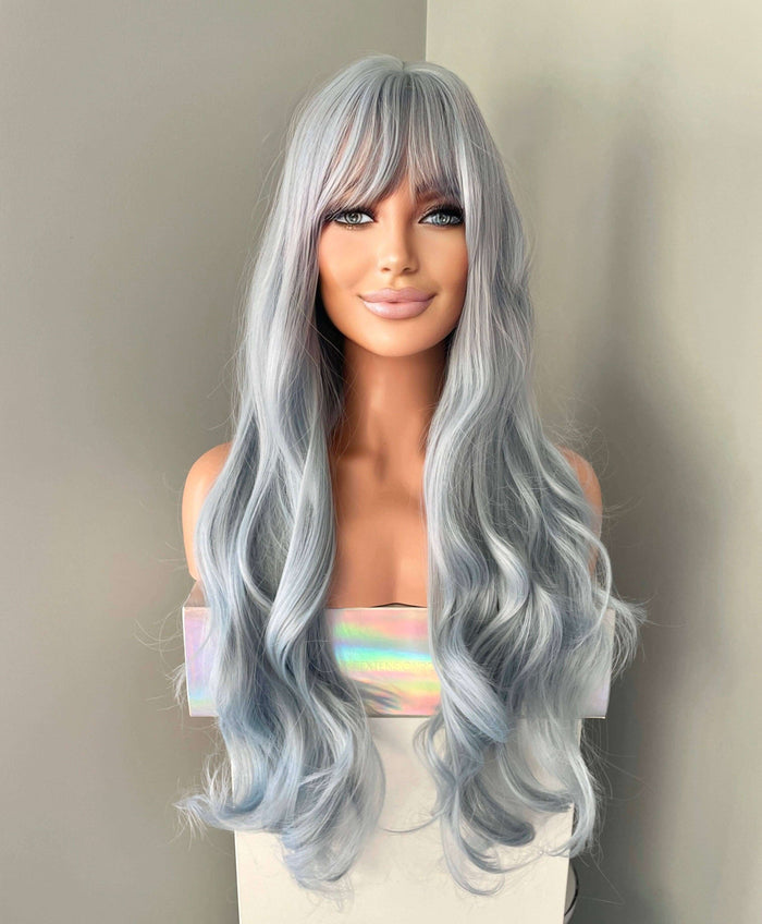 Azura Long Light Pastel Blue Wig displayed on a mannequin, showcasing long cascading waves in soft pastel blue.