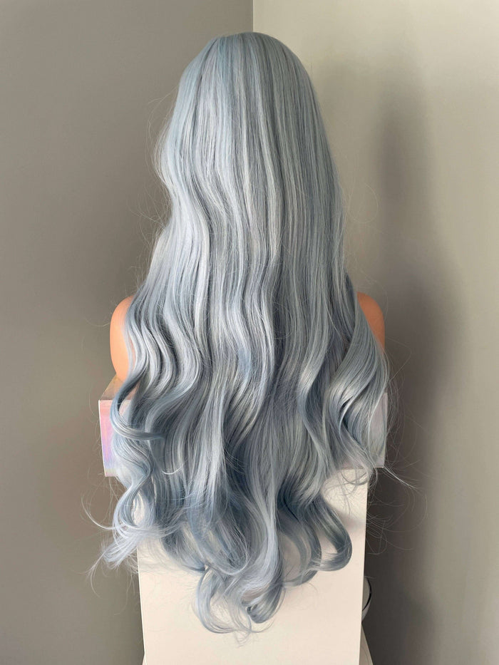 Back view of the Azura Long Light Pastel Blue Wig showcasing soft waves and pastel blue color.
