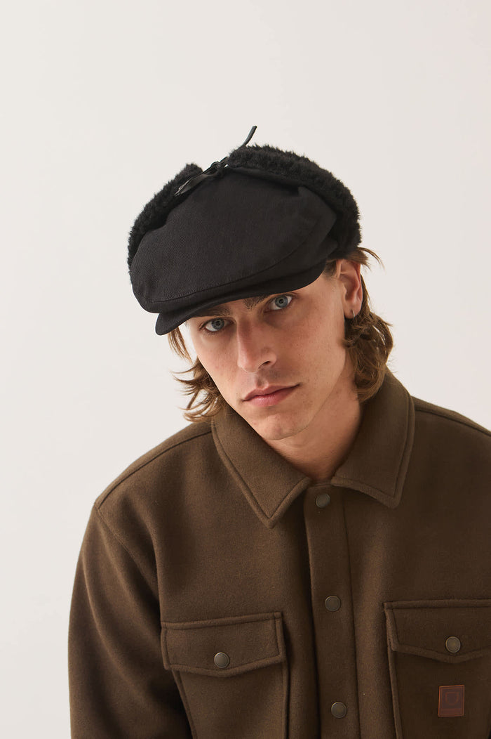 Unisex Barrel Earflap Snap Cap in the color Black/Black - Men's Front View