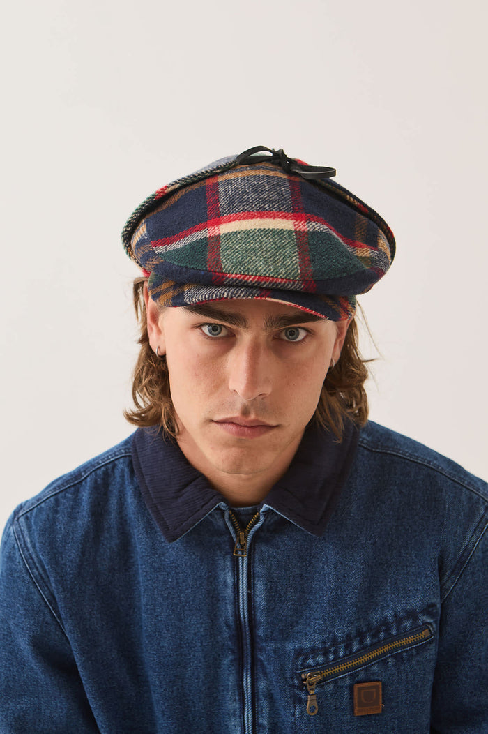 Unisex Barrel Earflap Snap Cap in the color Navy/Green/Red/Cream - Men's Front View