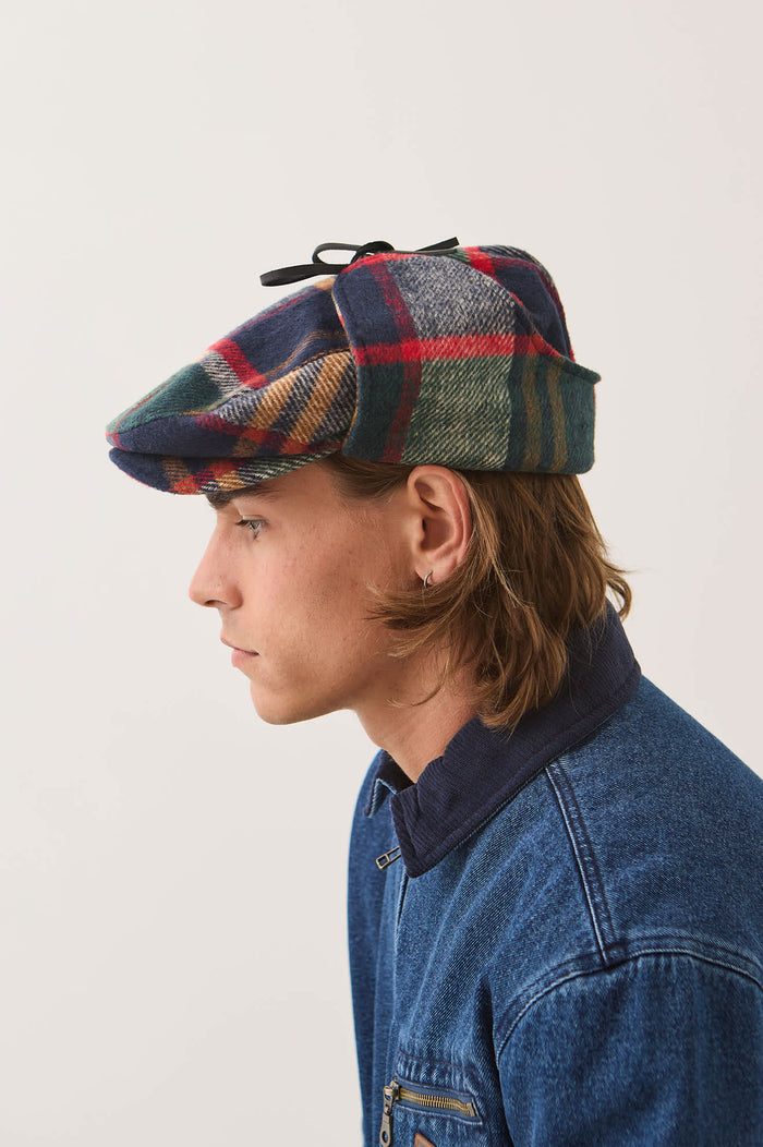 Unisex Barrel Earflap Snap Cap in the color Navy/Green/Red/Cream - Men's Side View