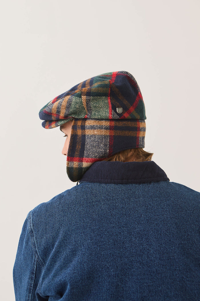 Unisex Barrel Earflap Snap Cap in the color Navy/Green/Red/Cream - Men's Back View