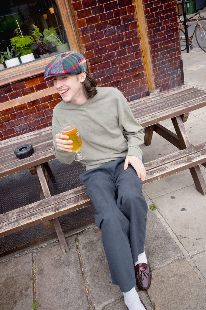 Unisex Barrel Earflap Snap Cap in the color Navy/Green/Red/Cream - Men's Lifestyle image