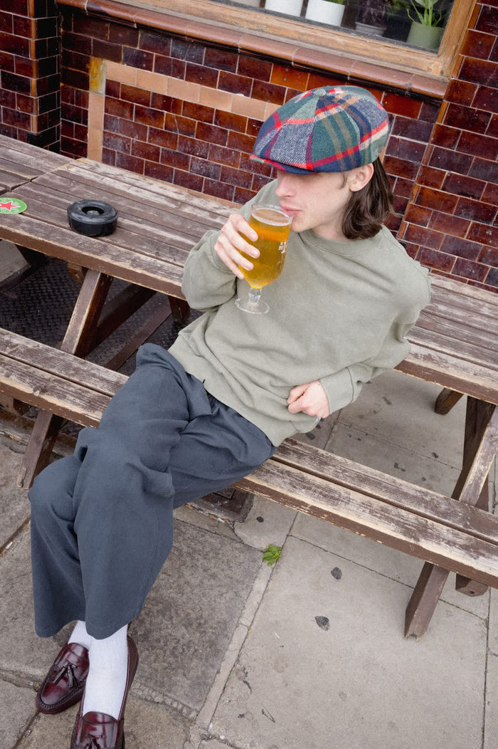 Unisex Barrel Earflap Snap Cap in the color Navy/Green/Red/Cream - Men's Lifestyle image