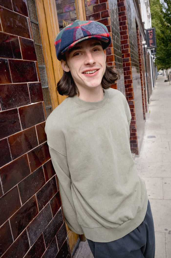 Unisex Barrel Earflap Snap Cap in the color Navy/Green/Red/Cream - Men's Lifestyle image