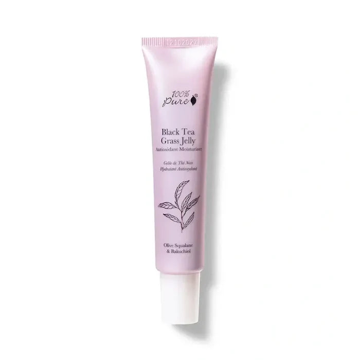 Pink tube of Black Tea Grass Jelly on a white background
