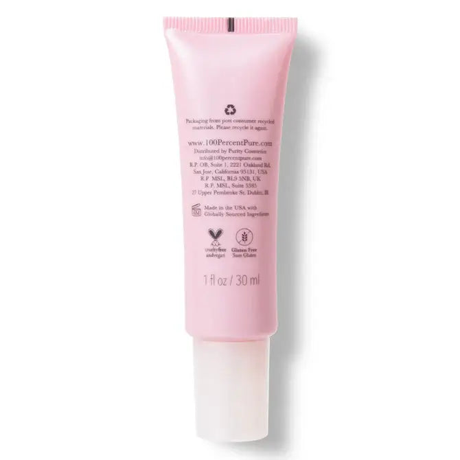 Pink skincare tube on a white background