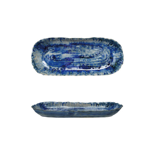 The CREATIVE COOP BLUE STONEWARE ORGANIC-SHAPED PLATTER features a wavy, textured edge and is shown from top and side angles. Its hand-crafted appeal is enhanced by a reactive crackle glaze in blue with white accents.