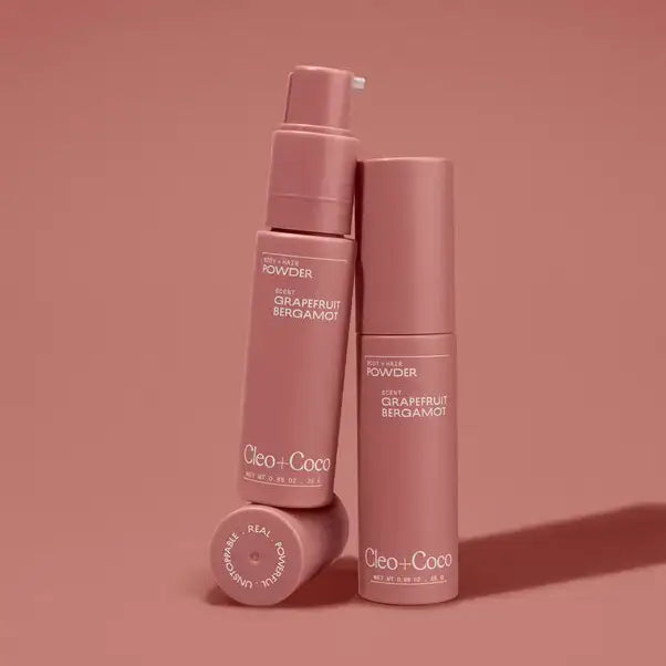 Three pink bottles of Cleo + Coco on a matching pink background