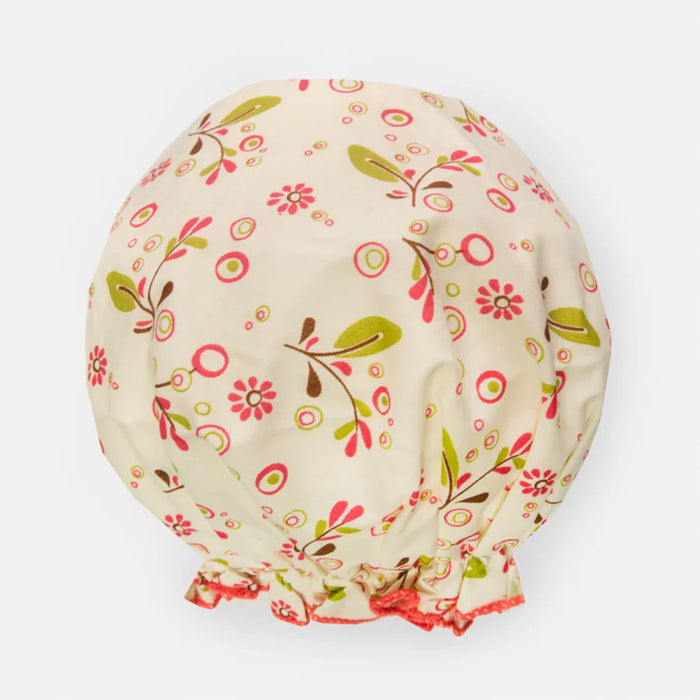 The BATH ACCESSORIES COMPANY's BOUFFANT SHOWER CAP - OLIVE LEAVES features a delightful floral pattern in pink, green, and brown on a light beige background. Its elastic edge ensures a snug fit, and the waterproof inner layer keeps your hair dry and protected.