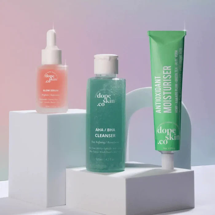 Three skincare products from 'dope skin co' on a white and light purple background