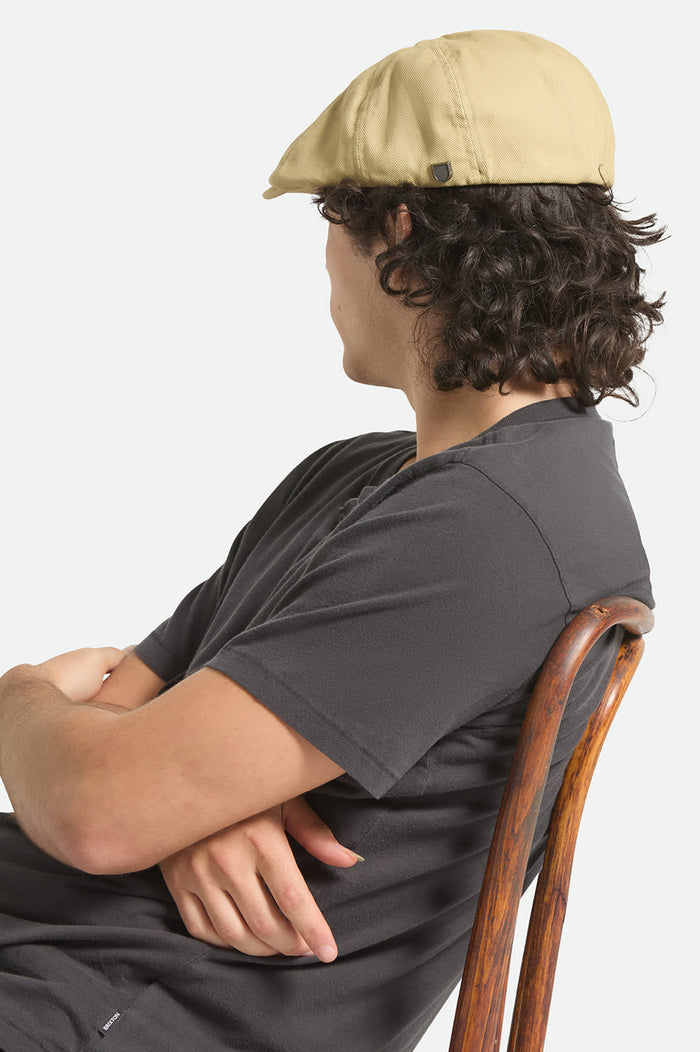 Unisex Brood Lightweight Newsboy Cap in the color Washed Khaki - Men's Back View