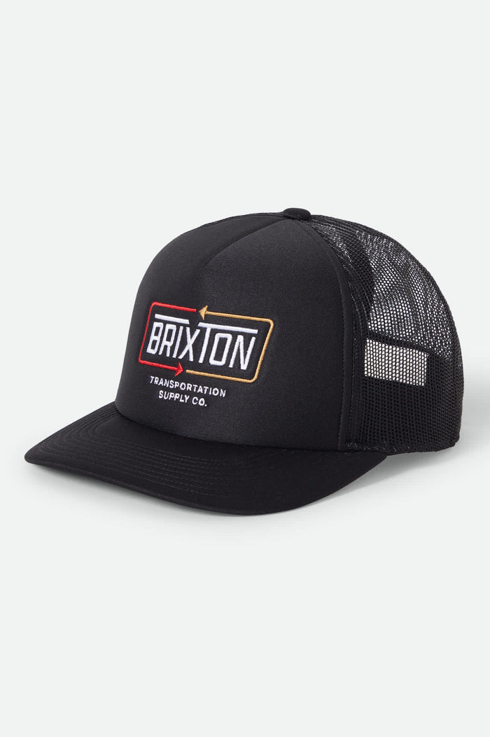 Unisex Caldwell Netplus Trucker Hat in the color Black/Black - Front Product View