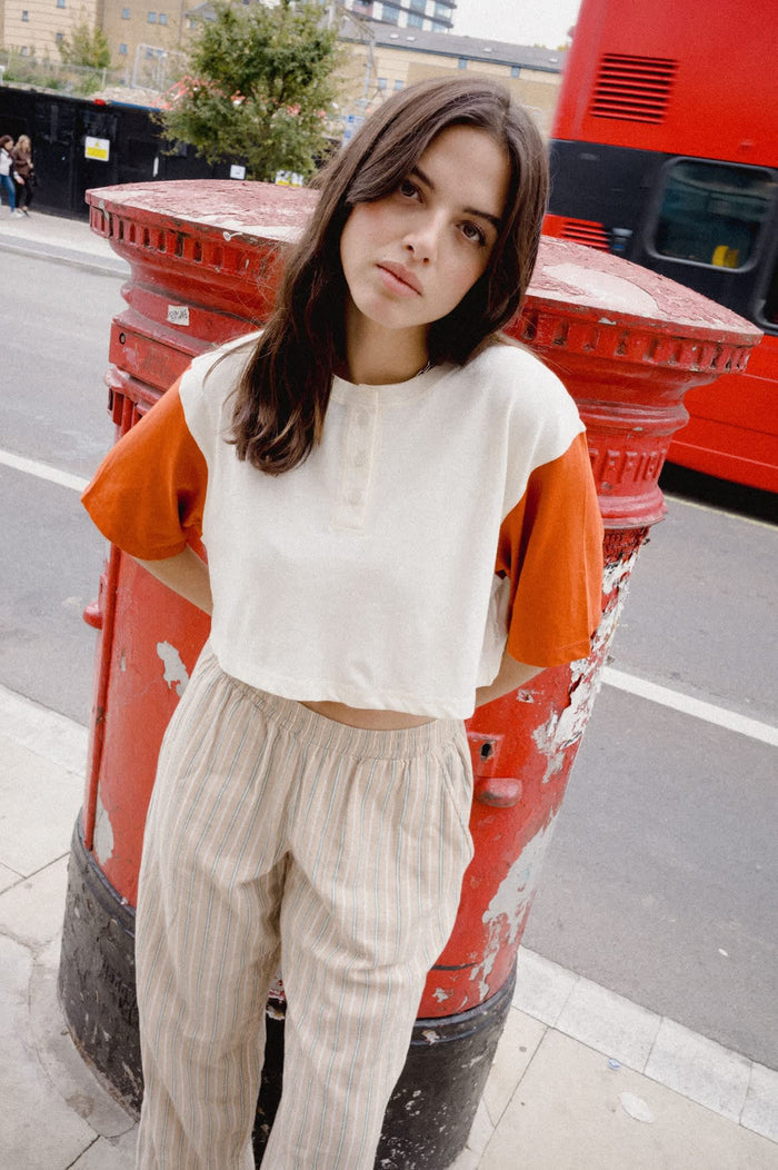 Women's Carefree Organic Garment Dye Cropped Henley in the color Off White/Rust - Women's Lifestyle image