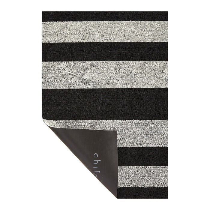 The CHILEWICH Black and White Bold Stripe Shag Doormat, measuring 18x28, features a rectangular design with alternating horizontal black and white stripes, offering an easy-care solution perfect for both indoor and outdoor use.