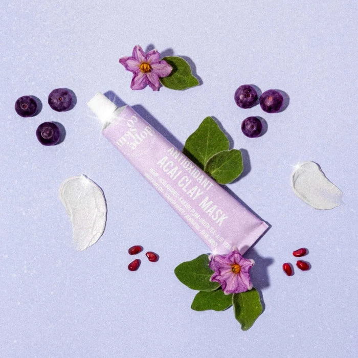 Tube of Real Clay Mask with natural elements on a light purple background