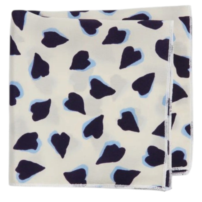 The CLIFTON WILSON - NAVY AND WHITE HEARTS SILK POCKET SQUARE features a square beige silk design with navy and white heart patterns, making it an ideal unique accessory for weddings.