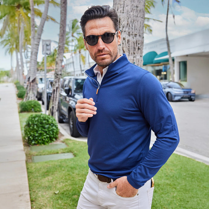 Close-up of COLLARS AND CO's PALM PIMA BLEND QUARTER ZIP IN NAVY, featuring dark blue fabric with a soft, textured surface and subtle sheen—perfect for lightweight layering and modern comfort.