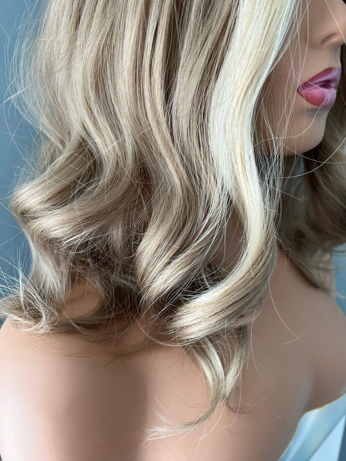 Dana Short Blonde Wig with Highlights showcasing soft waves and stylish length.