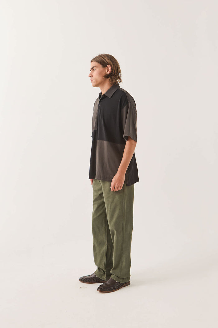 Men's Deco Relaxed Polo T-Shirt in the color Washed Black - Men's Side View