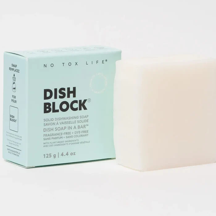 Solid dishwashing soap block with packaging labeled 'No Tox Life' on a light background