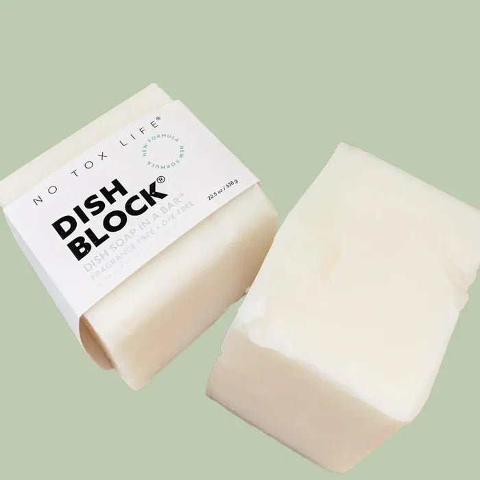 Dish Block soap bar with packaging on a light green background