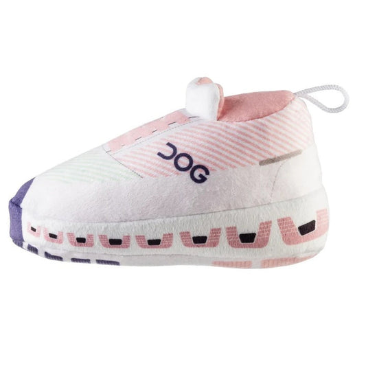 Introducing the DOG WORKOUT SHOE DOG TOY from HAUTE DIGGITY DOG—a plush slipper-shaped toy styled like a pink and white sneaker with "DOG" written on the side, a thick sole, and a handy loop at the back, all designed to mimic a fun workout shoe for playful pups.