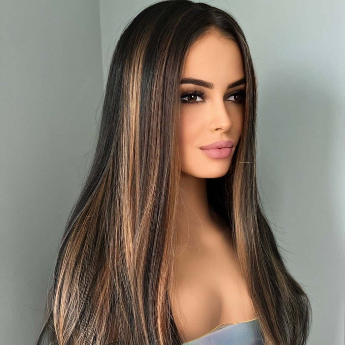 Woman with long, straight hair against a plain background
