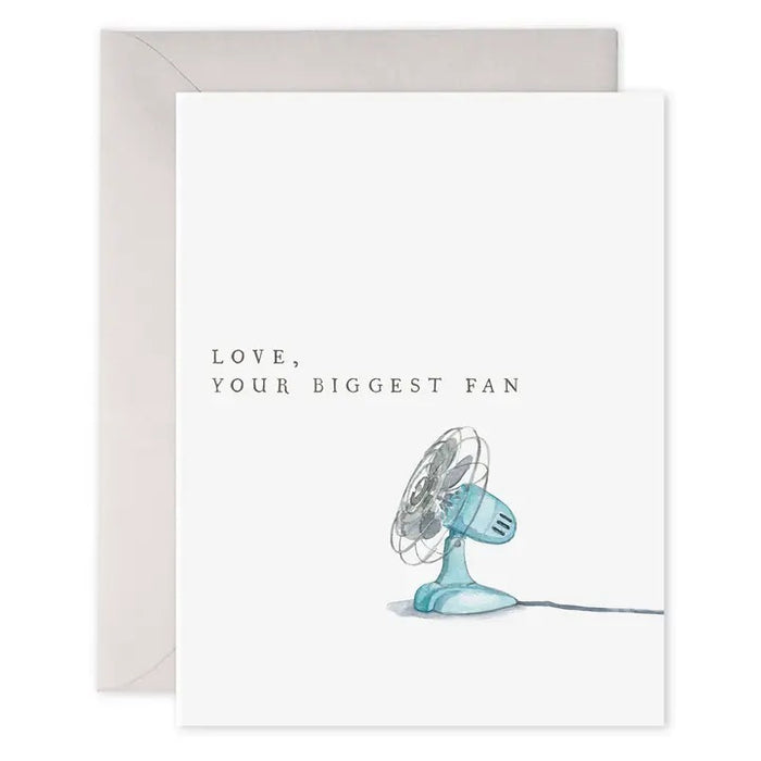 The E. FRANCES - BIGGEST FAN CARD by E. FRANCES PAPER is a watercolor greeting card featuring a charming illustration of a blue electric fan with the message "LOVE, YOUR BIGGEST FAN" printed above it. The card comes with an envelope placed behind it, making it the perfect just because card to let someone know you care. Proudly made in the USA.