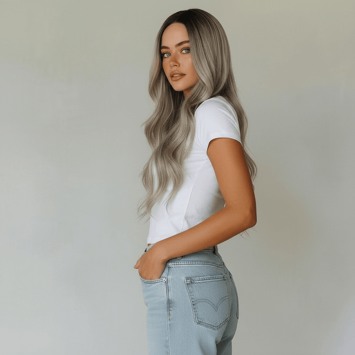 Model showcasing the Erika Long Silver Blonde Body Wave Wig, featuring soft waves and a polished finish.