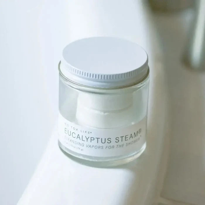 Jar of Eucalyptus Steam product on a white surface